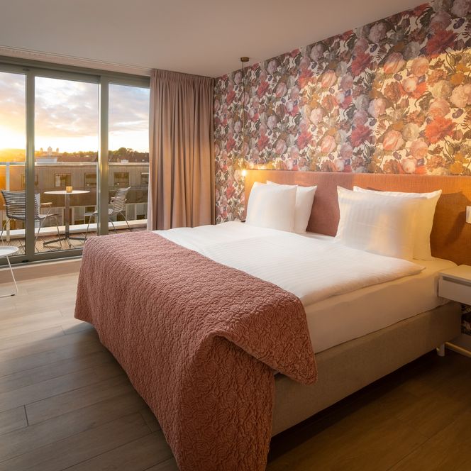 Zu sehen ist die Suite Rose Schlafbereich des Van der Valk Hotel Hildesheim